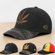 AKJ Fashion black polyester baseball cap with embroidered gold cannabis leaf and camouflage brim. Adjustable strap for outdoor use.