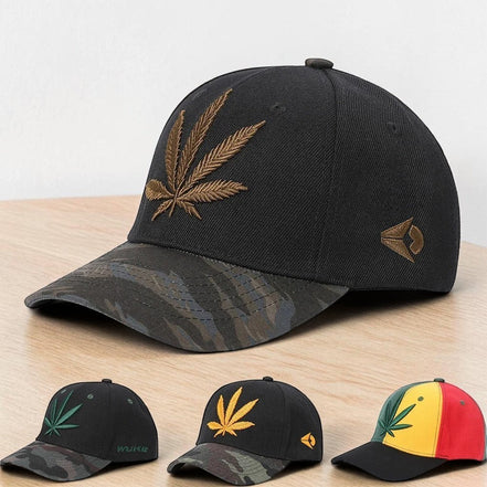 AKJ Fashion black polyester baseball cap with embroidered gold cannabis leaf and camouflage brim. Adjustable strap for outdoor use.