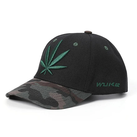 AKJ Fashion black polyester baseball cap with green cannabis leaf embroidery and camouflage brim. Adjustable strap.