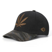 AKJ Fashion black polyester baseball cap with embroidered gold cannabis leaf and camouflage brim. Adjustable strap.