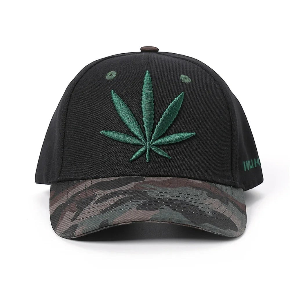 AKJ Fashion black polyester baseball cap with green cannabis leaf embroidery and camouflage brim. Adjustable strap.