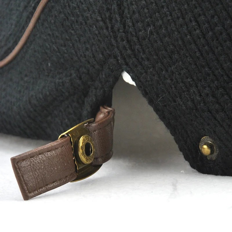 AKJ Fashion men's black knit beret with leather strap and brass hardware, vintage style.
