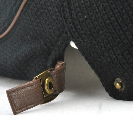AKJ Fashion men's black knit beret with leather strap and brass hardware, vintage style.
