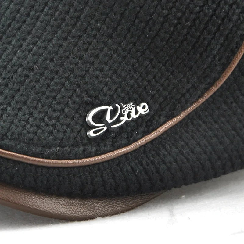 AKJ Fashion black knitted beret with leather trim and silver logo detail