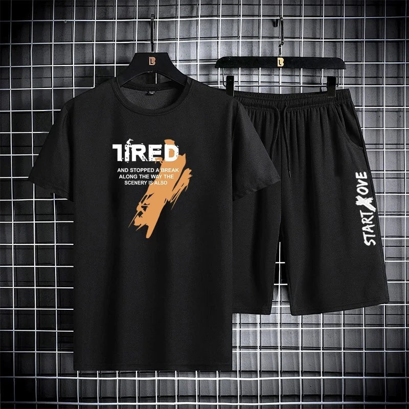 AKJ Fashion black two-piece men's quick-dry sport set with graphic print t-shirt and drawstring shorts.