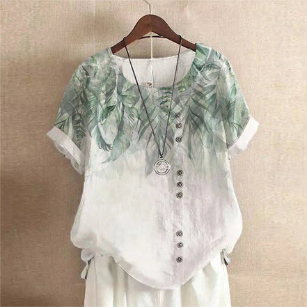 AKJ Fashion blouse verte à imprimé feuilles de glycines, col rond, manches courtes retroussées, boutonnage décalé, effet lin.