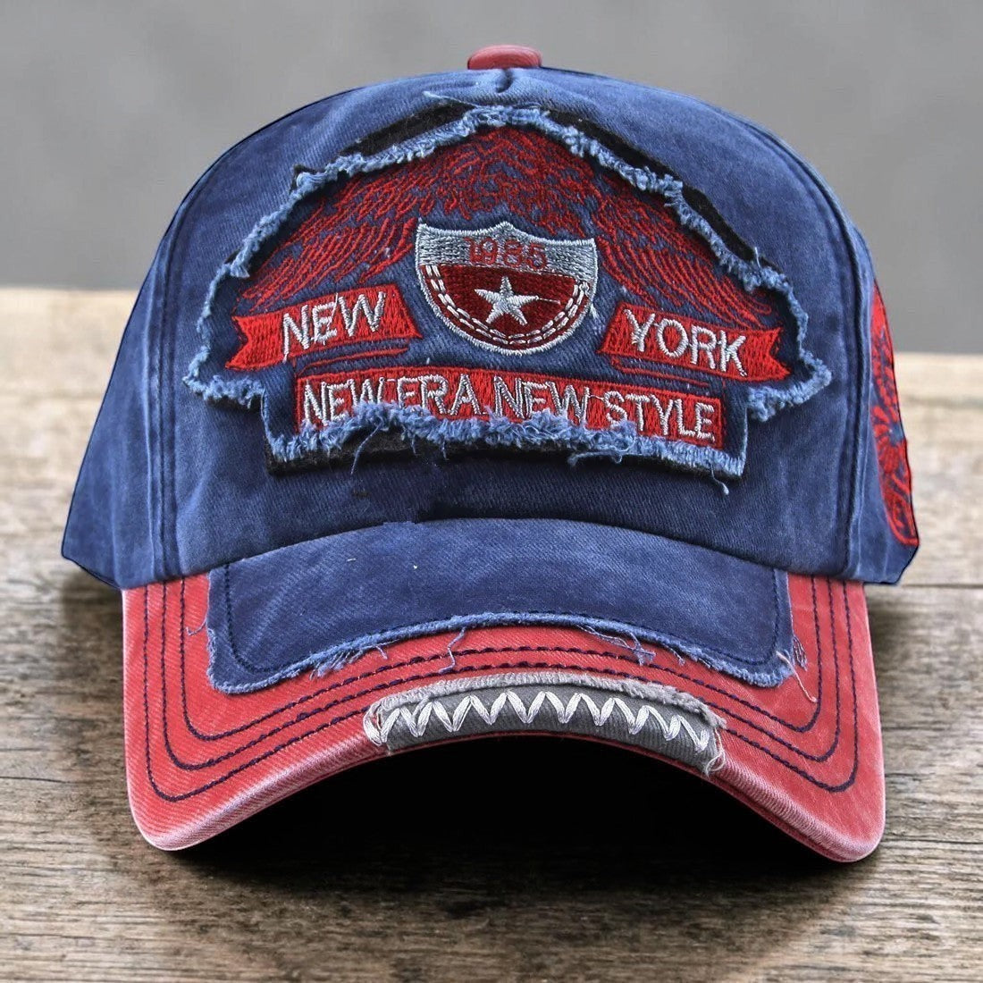 AKJ Fashion blue and red distressed cotton denim baseball cap with New York embroidery and adjustable strap.