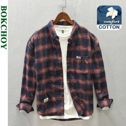 AKJ Fashion Chemise à carreaux bleu marine et écru en coton brossé, coupe décontractée, col classique, poche poitrine.