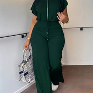 AKJ Fashion ensemble deux pièces vert émeraude, top zippé et pantalon large taille haute fluide.