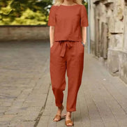 AKJ Fashion Ensemble deux pièces orange en tissu effet lin, top droit manches courtes et pantalon taille élastiquée.
