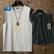 Ensemble AKJ Fashion 2 pièces pour homme : débardeur blanc et short gris foncé, coupe athlétique, idéal pour le sport.