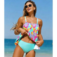 AKJ Fashion Ensemble Tankini & Bas de Bain motifs tropicaux fuchsia, turquoise, jaune et bas aqua. Bretelles larges, coupe évasée, coques intégrées. Tissu élastique.