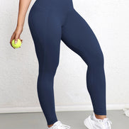AKJ Fashion legging bleu marine taille haute avec poches latérales, coupe ajustée pour le sport et le quotidien.