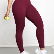 Legging AKJ Fashion bordeaux à double poche, coupe ajustée pour affiner la silhouette, tissu résistant.