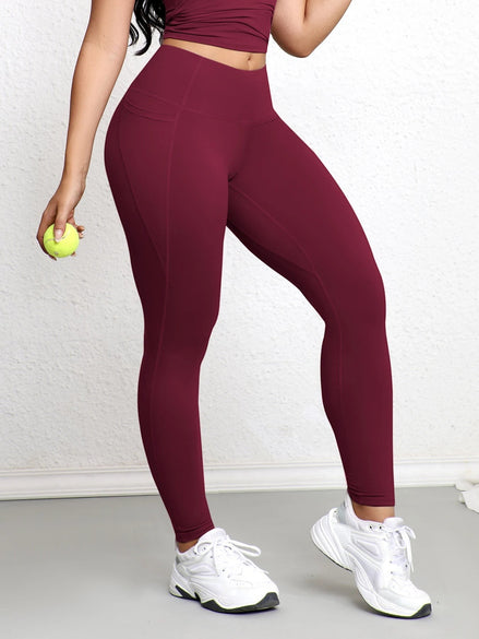Legging AKJ Fashion bordeaux à double poche, coupe ajustée pour affiner la silhouette, tissu résistant.