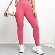 Legging rose vif AKJ Fashion avec poches latérales, coupe ajustée et tissu résistant pour le sport ou le quotidien.