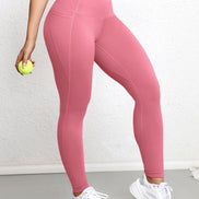 Legging rose poudré AKJ Fashion avec poches latérales, coupe ajustée, idéal pour le sport et le quotidien.