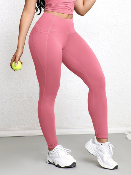 Legging rose poudré AKJ Fashion avec poches latérales, coupe ajustée, idéal pour le sport et le quotidien.