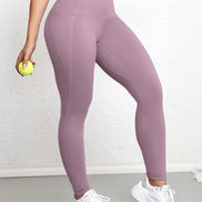 AKJ Fashion legging violet clair avec poches latérales, coupe ajustée, idéal pour le sport et le quotidien.