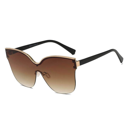 Lunettes de soleil oversize œil de chat AKJ Fashion, monture semi-monture dorée et noire, verres dégradés marron.
