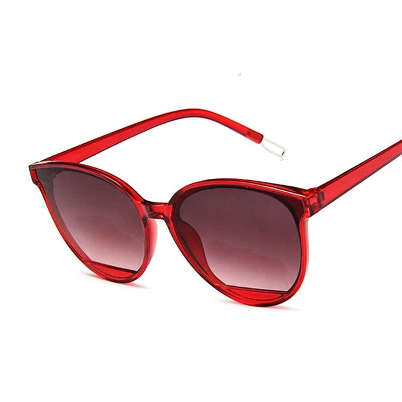 Lunettes de soleil AKJ Fashion rétro rouges, monture plastique, verres miroir dégradé, forme cat-eye.