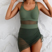 AKJ Fashion Maillot de bain une pièce vert kaki avec jupon froncé en résille et bande transparente à la taille. Bretelles croisées.