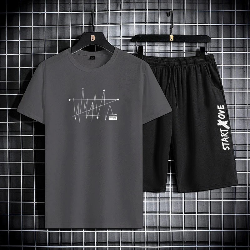AKJ Fashion men's dark grey t-shirt and black shorts set with graphic print and text detail. Quick-dry athletic wear.