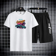 AKJ Fashion men's white t-shirt with 'Garage' graphic and black shorts with 'START X OVE' print. Quick-dry technical fabric.