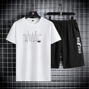 AKJ Fashion men's white t-shirt and black shorts set with graphic print and text detail. Quick-dry fabric.