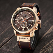 Montre chronographe CURREN homme en acier inoxydable doré, cadran marron avec 3 sous-compteurs et bracelet en cuir marron.