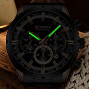 Montre AKJ Fashion CURREN argent, boîtier large en acier inoxydable, cadran noir avec aiguilles lumineuses et date automatique. Style moderne.