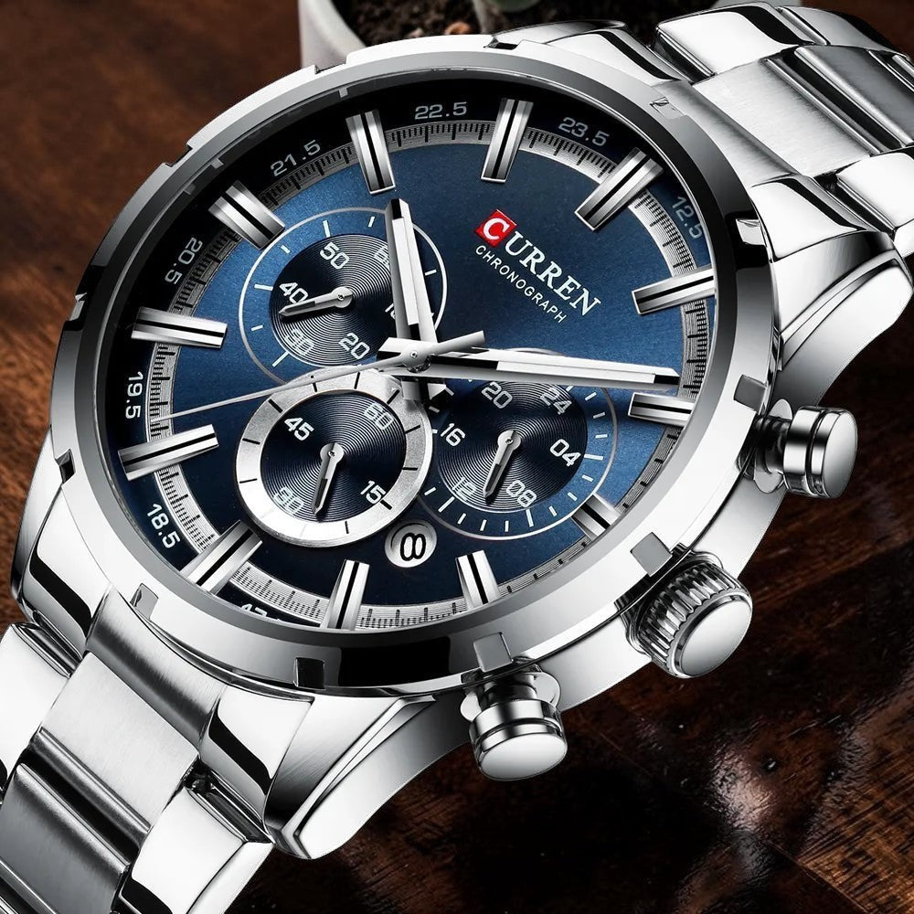Montre AKJ Fashion CURREN argentée en acier inoxydable avec cadran bleu, chronographe et date automatique.