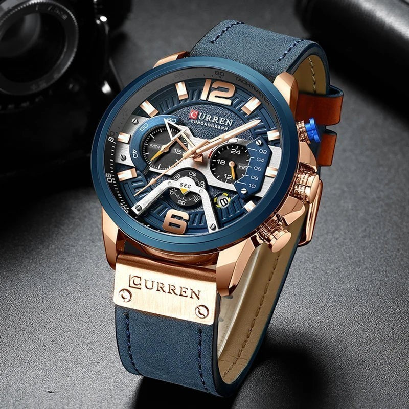 Montre AKJ Fashion CURREN homme, bracelet cuir bleu, boîtier or rose, cadran bleu multifonction, style urbain.