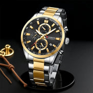 Montre AKJ Fashion CURREN Sport homme, cadran noir 44mm, bracelet bicolore argent et or, chronographe, style sportif chic.