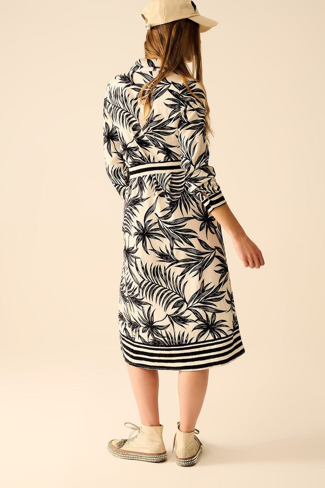 AKJ Fashion robe à manches longues imprimé tropical noir et blanc, ceinture noire, longueur genou, col chemise.