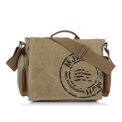 Sac bandoulière AKJ Fashion en toile kaki vintage avec logo circulaire noir et bandoulière réglable.