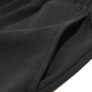 Short de fitness AKJ Fashion noir en coton respirant avec poches latérales et cordon de serrage.