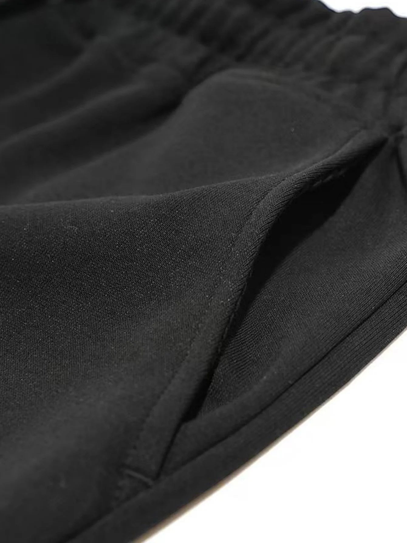 Short de fitness AKJ Fashion noir en coton respirant avec poches latérales et cordon de serrage.