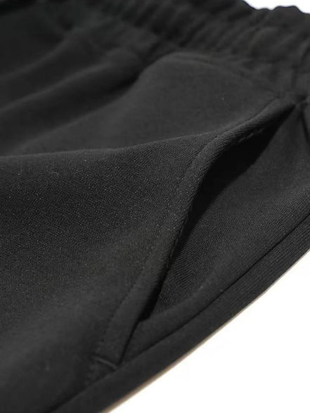 Short de fitness AKJ Fashion noir en coton respirant avec poches latérales et cordon de serrage.