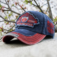 AKJ Fashion vintage distressed blue denim baseball cap with red accents and New York embroidery. Adjustable strap for adult unisex wear.