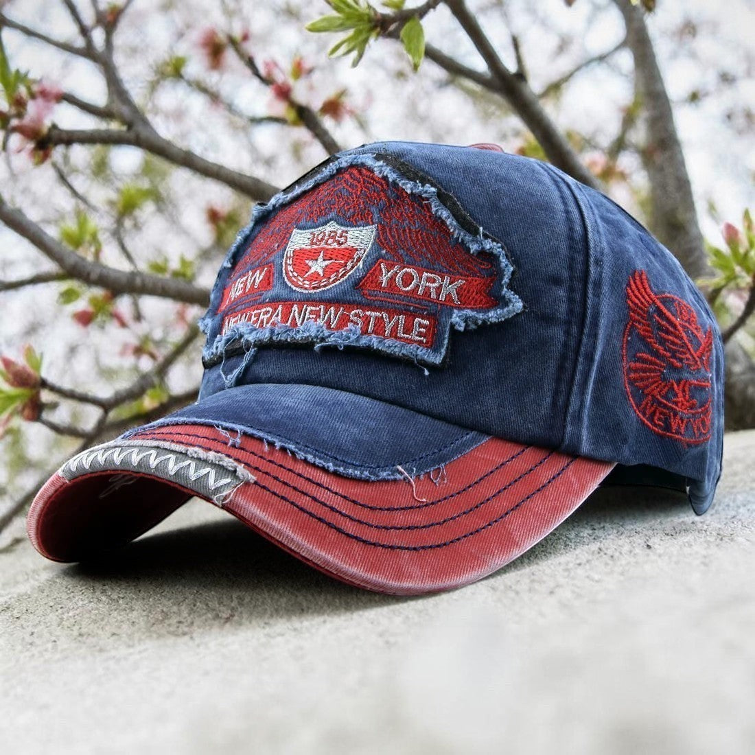AKJ Fashion vintage distressed blue denim baseball cap with red accents and New York embroidery. Adjustable strap for adult unisex wear.