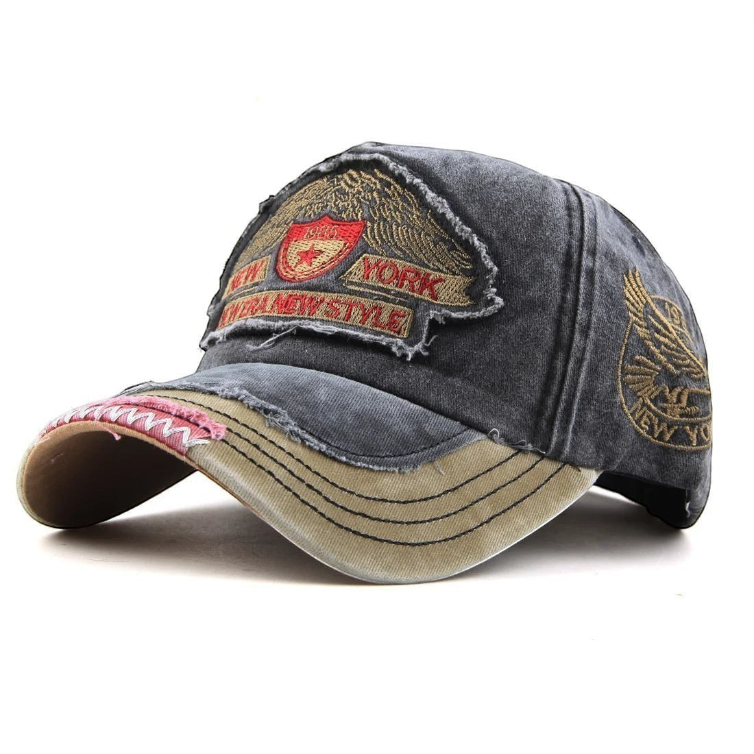 AKJ Fashion distressed charcoal denim baseball cap with embroidered New York patches and adjustable strap.