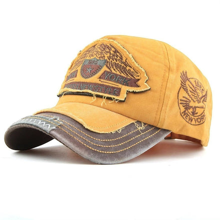 AKJ Fashion yellow cotton baseball cap with distressed details and New York patches. Adjustable strap for a comfortable fit.